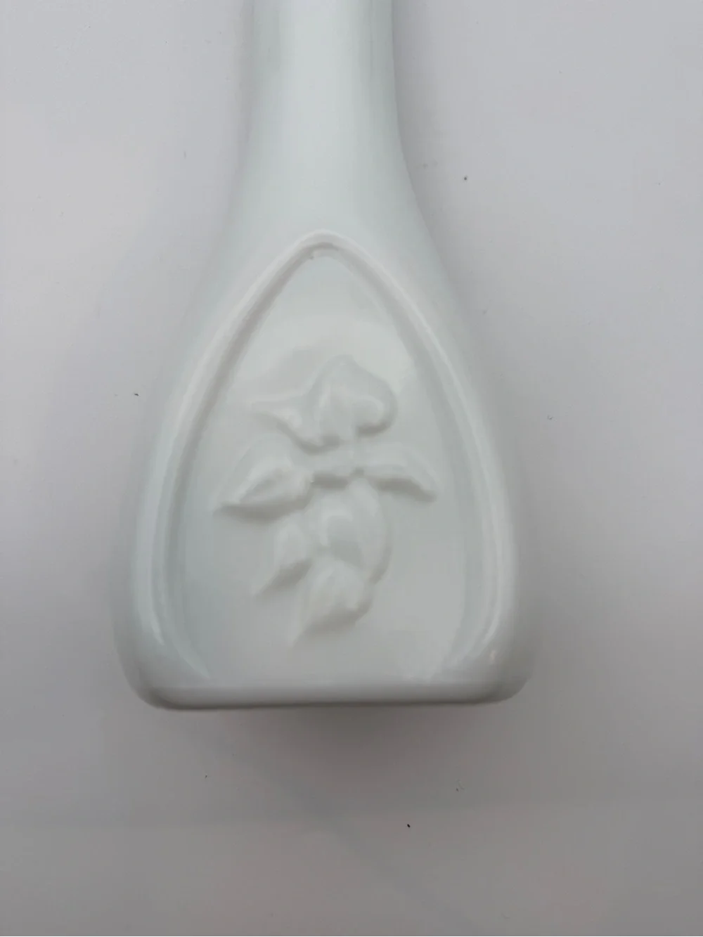 Vintage vase milk glass with embossed vines and scalloped rim